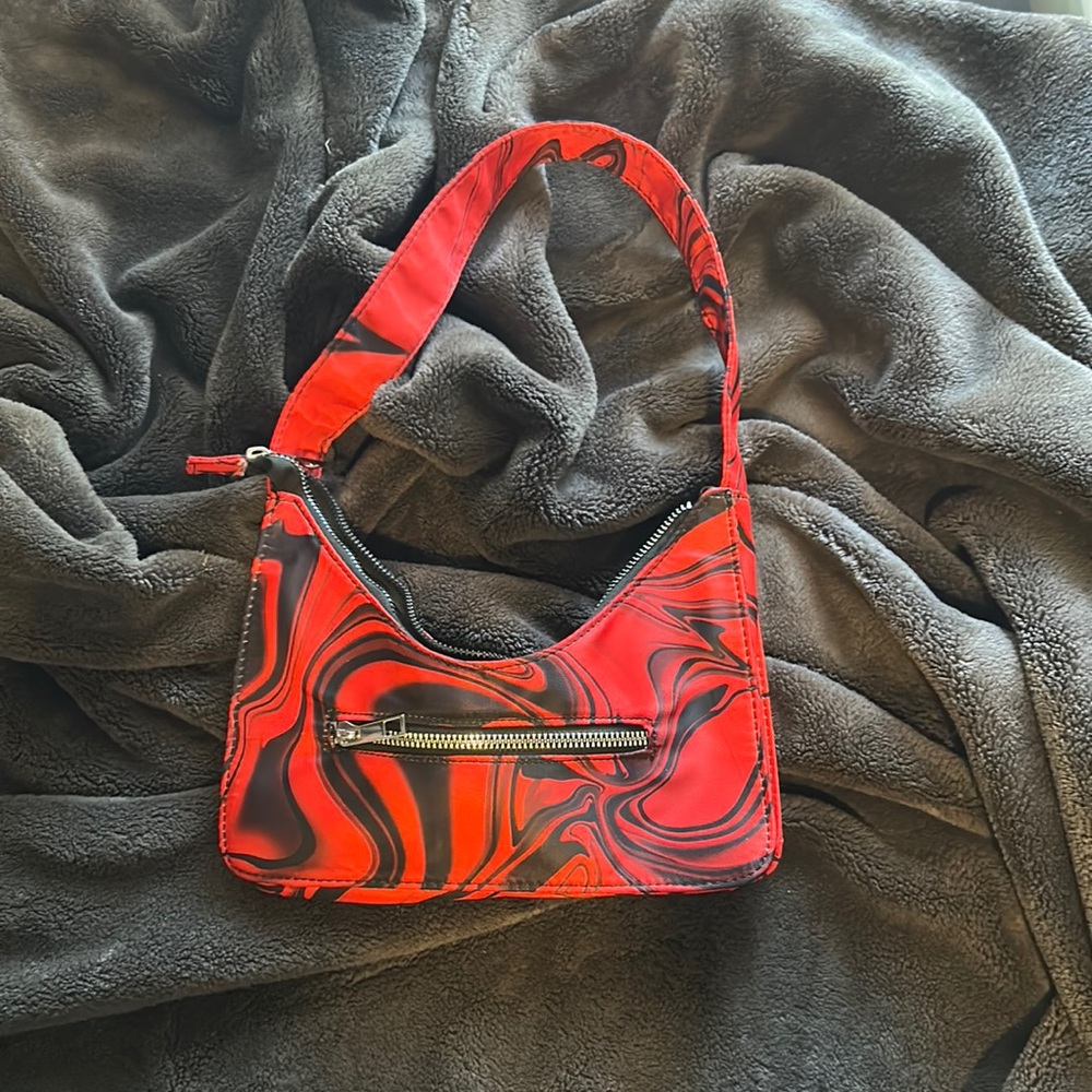 red and black marble bag